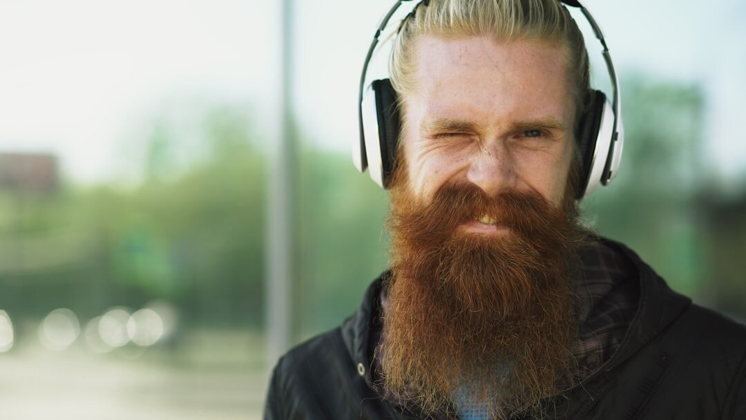 Studio portrait of a Finnish man in his forties wearing a headset