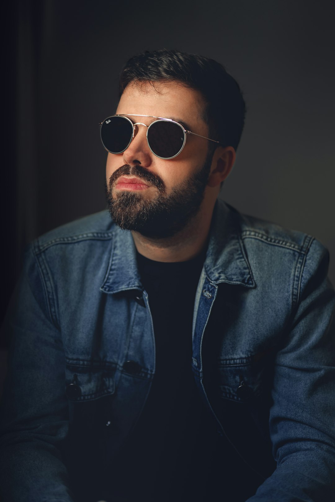 Studio portrait of a Finnish man in his thirties with a beard